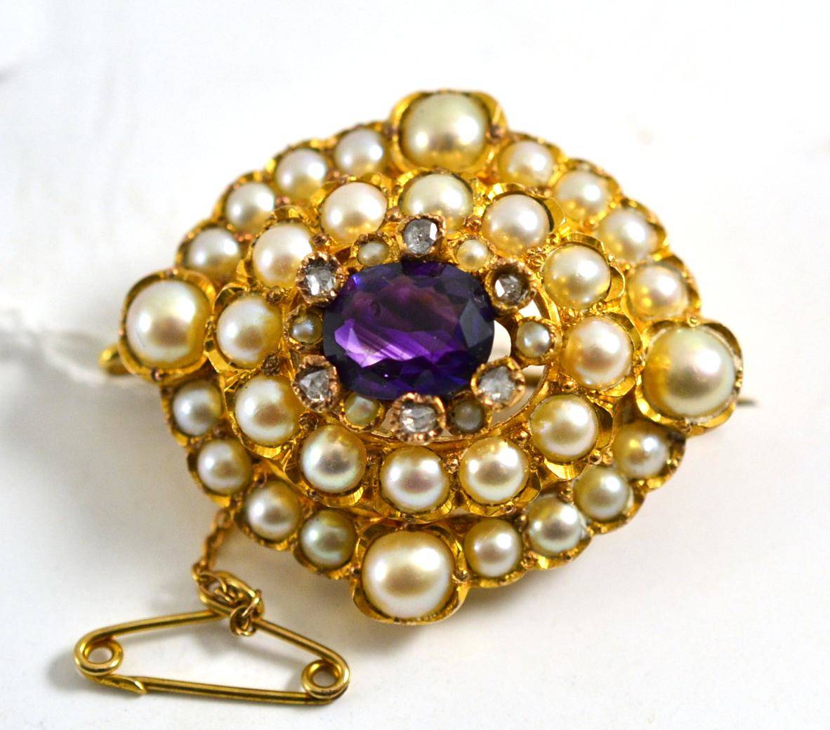 Lot 101 - An amethyst, diamond and split pearl brooch,