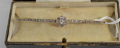 Lot 105 - An early 20th century diamond bar brooch, a cluster of old cut diamonds to a tapered bar set...