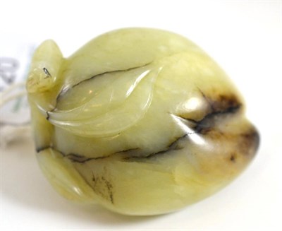 Lot 120 - A Chinese jade model of a peach, with leaves, 6.5cm wide