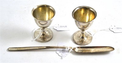 Lot 121 - Victorian silver marrow spoon and two silver egg cups