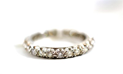 Lot 130 - An 18ct white gold diamond full eternity ring, round brilliant cut diamonds in a claw setting,...