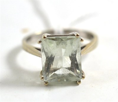 Lot 136 - A 9ct white gold pale mint green amethyst ring, the scissor cut mint green stone n a double...