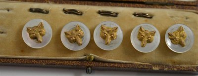 Lot 140 - Five mother-of-pearl and 9ct gold dress studs decorated with fox head masks, in a fitted case