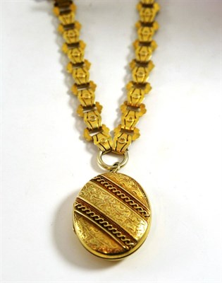 Lot 150 - A Victorian silver gilt locket on necklace, the hinged locket with decorative front, attached to an