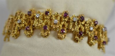 Lot 153 - A ruby and diamond bracelet, of textured links, set with round brilliant cut diamonds and round cut