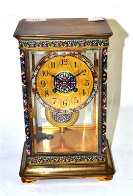 Lot 171 - A brass champleve enamel striking mantel clock, circa 1900, four glass case with multi-coloured...