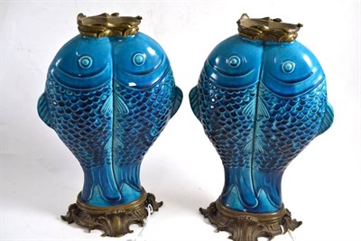 Lot 186 - A pair of 19th century ormolu mounted Chinese turquoise glazed porcelain vases, in the form of...