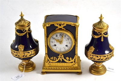 Lot 191 - A Sevres style striking mantel clock with garniture, early 20th century, dark blue ground case with