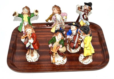 Lot 200 - Sitzendorf seven piece porcelain monkey band, conductor 13.5cm high