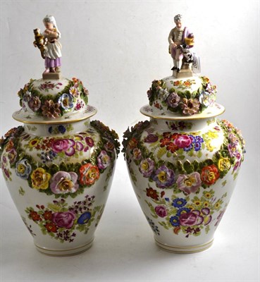 Lot 207 - Pair of 19th century Dresden porcelain flower encrusted baluster jars and covers, painted with...