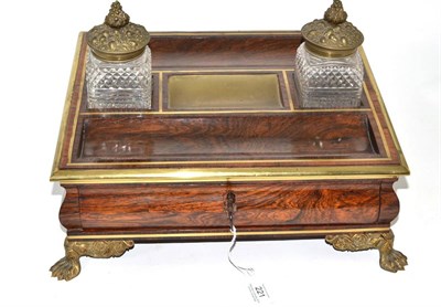 Lot 221 - A Regency rosewood inkstand with catalogue and price list, 39cm wide     Ex lot 160 Castle...