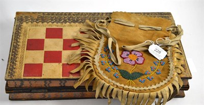 Lot 228 - A North American beadwork tobacco pouch and a English games board modelled as two books (2)