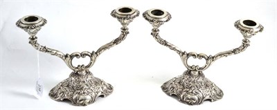 Lot 238 - Pair of white metal two branch candelabrum, 18cm high