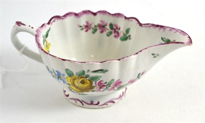 Lot 241 - A Bow porcelain sauce boat, circa 1765, painted with flower sprays, 15.5cm wide