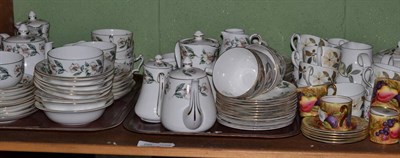 Lot 250 - A shelf of teawares including a Wedgwood floral tea set, Aynsley fruit decorated coffee cans...