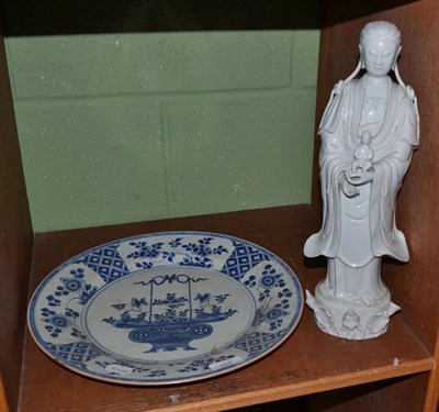 Lot 252 - A 19th century Chinese Blanc De Chine figure of Guanyin and a Chinese porcelain dish, K'ang Hsi...