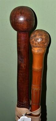 Lot 266 - An African staff knobkerrie and a bamboo cane