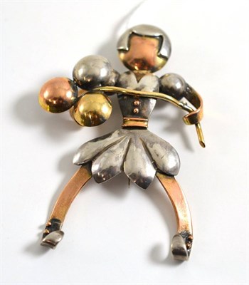 Lot 333 - A tri-colour figural brooch, as a girl holding balloons, measures 4.6cm by 6.5cm