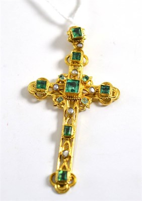 Lot 334 - An emerald and pearl cross, of ornate form, inset with step cut emeralds and small pearls, measures