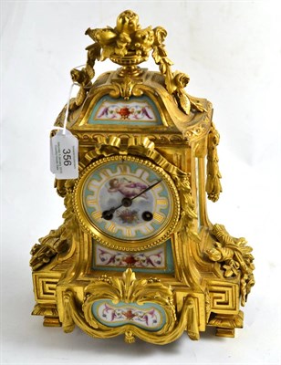 Lot 356 - ^ A gilt metal and porcelain striking mantel clock, circa 1890, turquoise and gilt decorated...