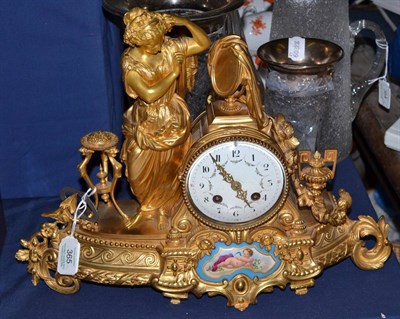 Lot 365 - A gilt metal striking mantel clock, circa 1890, case depicting a classical figure in robes,...