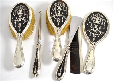 Lot 368 - Tortoiseshell mirror, two brushes, boot pull and shoe horn