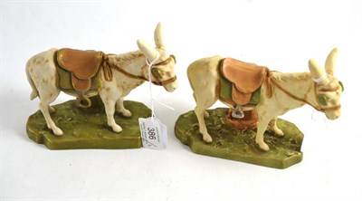 Lot 386 - Two Royal Dux figures modelled as donkeys, 13cm high