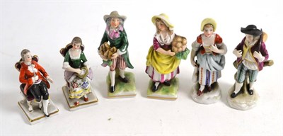 Lot 404 - Pair of French porcelain miniature figures of street vendors, 8cm high; a similar pair of...