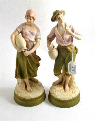 Lot 411 - Pair of Royal Dux figures modelled as water carriers, 29cm high