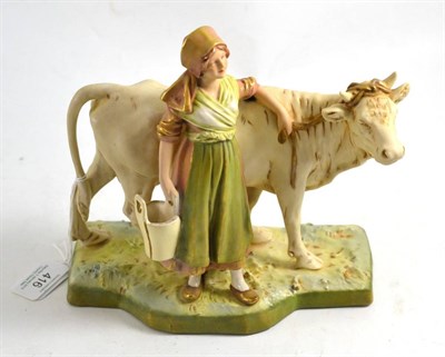 Lot 416 - Royal Dux figure modelled as a milkmaid with cow, 20cm high