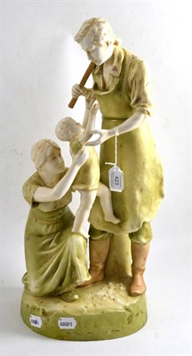 Lot 423 - Royal Dux figure group modelled as a blacksmith with wife and child, 53cm high