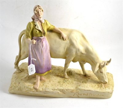 Lot 426 - Royal Dux figure modelled as lady beside a bull, 36cm wide (base)