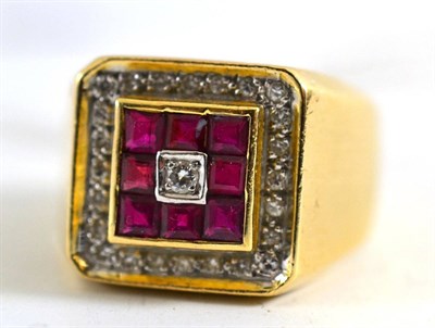 Lot 459 - A gentleman's diamond and ruby ring, a central round brilliant cut diamond is bordered by a row...