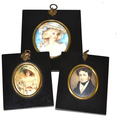 Lot 464 - Two 19th century portrait miniatures depicting a lady wearing a hat and a miniature portrait of...