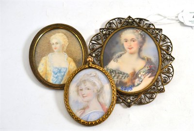 Lot 465 - A 19th century portrait miniature of a lady signed 'May' within a gilt filigree frame, 8cm...