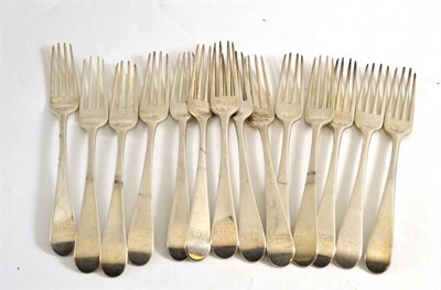 Lot 469 - Fourteen George III silver table forks, London 1782, each engraved with a (worn) crest, being a ram