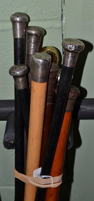 Lot 495 - Ten assorted walking sticks including ebony examples with silver pommels