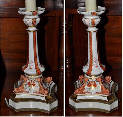 Lot 501 - Pair of possibly Derby candlesticks mounted as table lamps, 56cm high (including fitment)