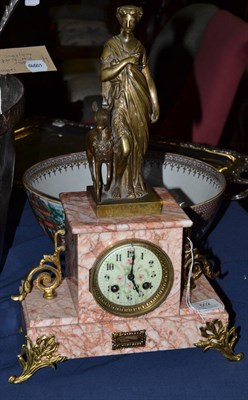 Lot 502 - A marble striking mantel clock, circa 1910, patinated figure with a deer beside, gilt metal mounts