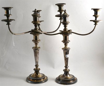 Lot 510 - Pair of Victorian silver plated three-light candelabra, 50cm high