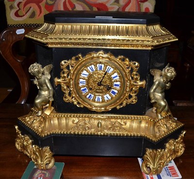 Lot 511 - An ormolu and black slate striking mantel clock, circa 1880, winged cherubs and ormolu scroll...