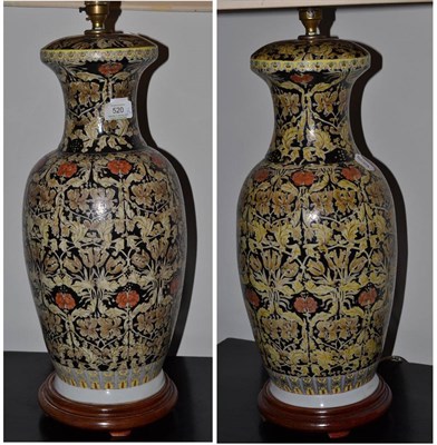 Lot 520 - A pair of Chinese polychrome decorated table lamps, 83cm high including shade and a blue and...