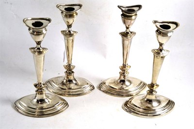 Lot 537 - Set of four silver candlesticks, 24cm high