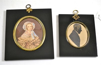 Lot 596 - Miniature watercolour portrait of a lady and a silhouette of a gentleman