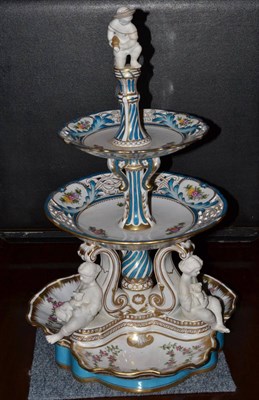 Lot 604 - A Continental floral decorated three tier centrepiece/cake stand, height 83cm