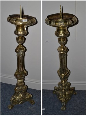 Lot 612 - Pair of Victorian brass candlesticks of large proportions