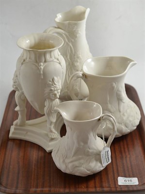 Lot 616 - Two Parian lilly pattern jugs stamped 'Livesley Powell & Co', another Parian jug and a tripod vase