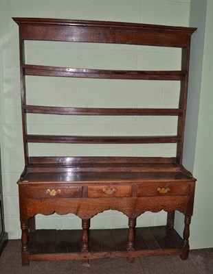 Lot 652 - An 18th century joined oak tall dresser, probably Montgomeryshire, the rack with three fixed...