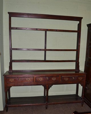 Lot 654 - An 18th century oak dresser with pot board and rack