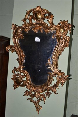 Lot 655 - A brass cartouche shaped wall mirror